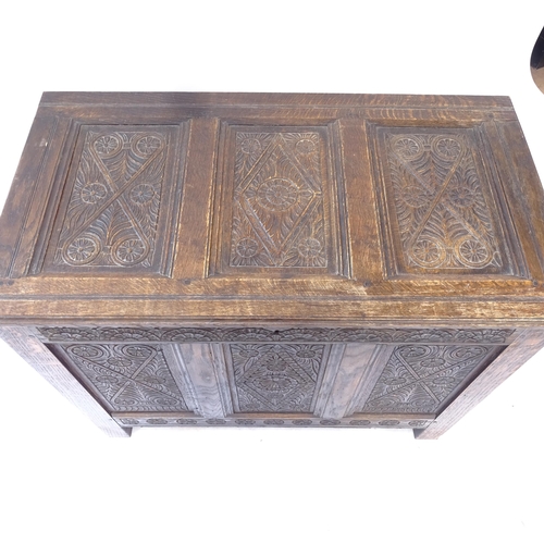 2066 - An Antique joined oak coffer, with chipped carved panelled decoration on stile legs, W88cm, H72cm, D... 