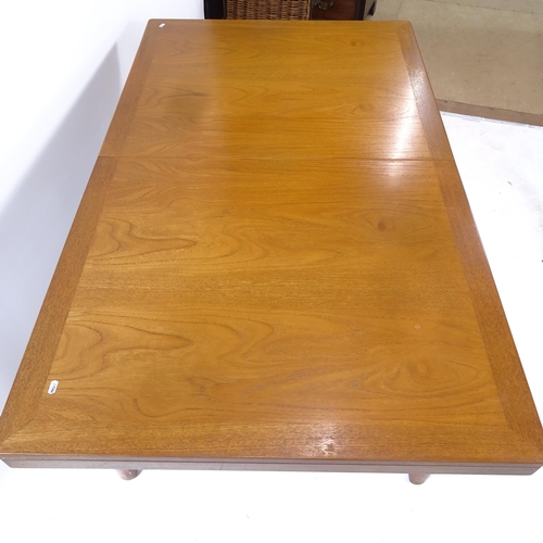 2067 - A mid-century teak crossbanded draw leaf dining table, L153cm extending to 197cm, H76cm, D91cm