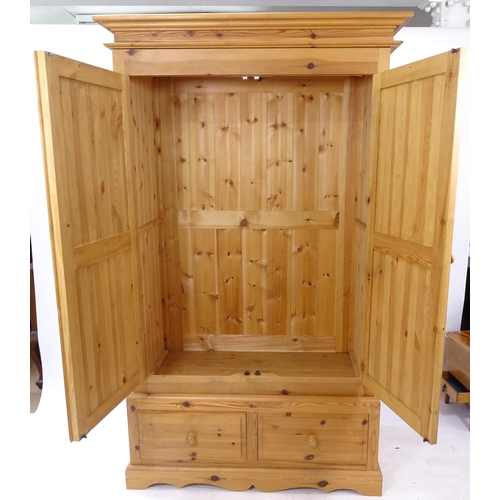 2070 - A modern pine 2-door wardrobe with-2 drawer base, W120cm, H210cm, D62cm