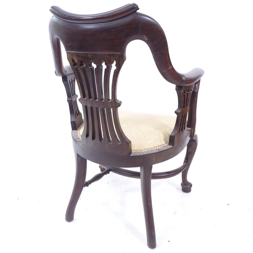 2086 - A 19th century mahogany desk chair, with crinoline stretcher