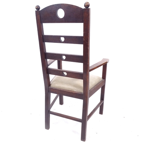 2091 - An Arts and Crafts oak ladder-back armchair, with heart and circle cut-outs