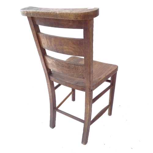 2107 - A 1920s oak chapel chair, engraved J. S. Macnaghten 1923 - 1928