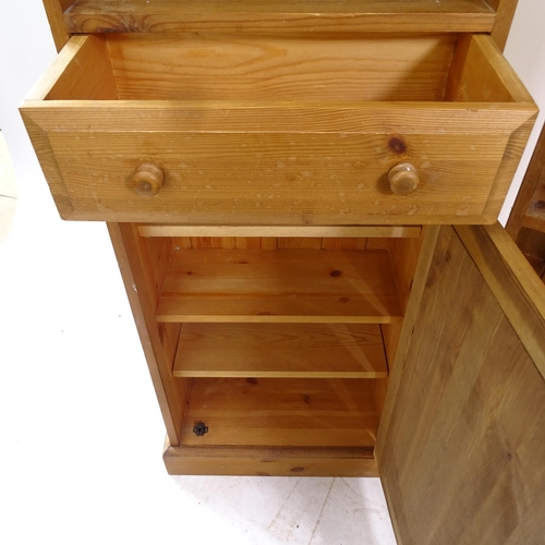 2115 - A modern pine narrow open bookcase, with 2 fixed shelves, and fitted drawer and cupboard under, W55c... 