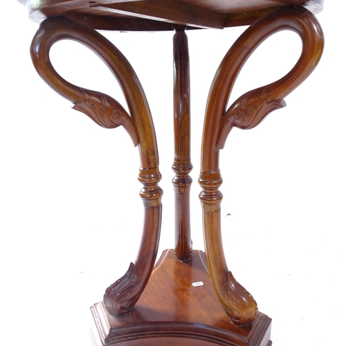 2118 - A reproduction mahogany circular lamp table, on bird carved legs and platform base, D50cm, H69cm