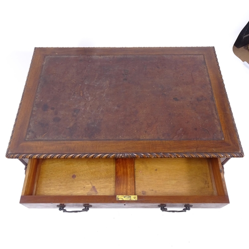 2124 - A mahogany rectangular writing table, with single frieze drawer, brown leather skiver, carved rope t... 