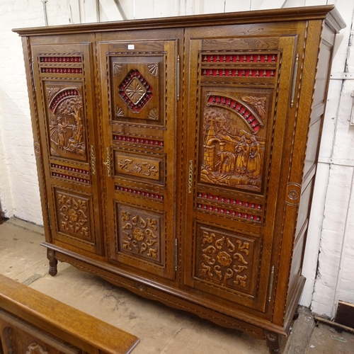 2133 - A Breton French oak bedroom suite, comprising a 3-door armoire, a 4' 6