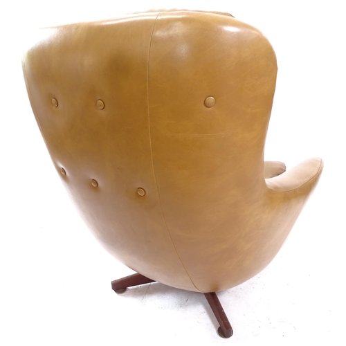 2136 - A mid-century faux leather upholstered egg chair