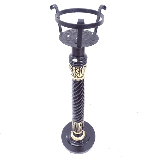 2139 - An Antique black and gilt painted wooden torchere stand, with cast-iron top, H115cm