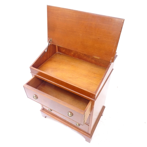 2161 - An early 20th century mahogany writing desk, with tooled and embossed red leather skiver, sliding to... 