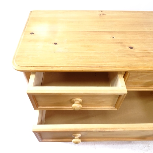 2166 - A reproduction polished pine chest of 2 short and 4 long drawers, on bun feet, W91cm, H109cm, D47cm