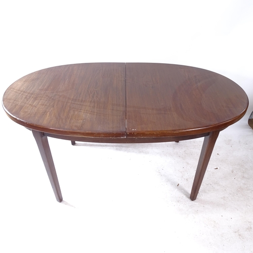 2258 - A mid-century oak oval extending dining table, L152cm extending to 199cm, H74cm, D92cm