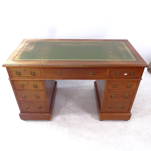 2261 - An Edwardian mahogany pedestal writing desk, with tooled and embossed green leather skiver, and 9 dr... 