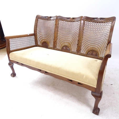 2267 - A 1920s  mahogany bergere 3-piece suite with cane backs and claw and ball feet, consisting of a 3-se... 