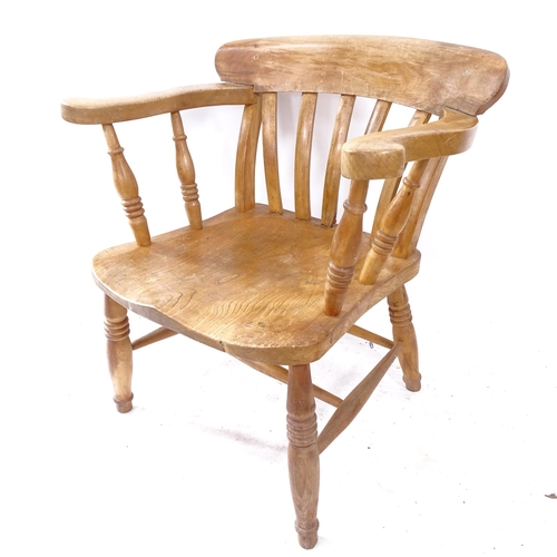 2271 - An early 20th century pine stick-back elbow chair