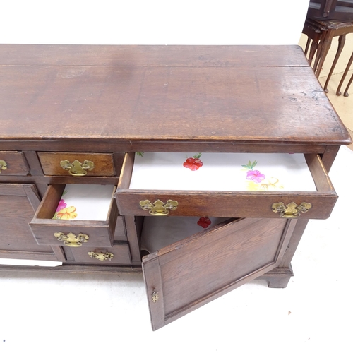 2273 - A 19th century oak dresser base, having 6 drawers and 2 panelled cupboard doors below, W144cm, H75cm... 