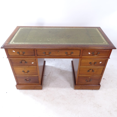 2282 - An Edwardian crossbanded mahogany twin-pedestal writing desk, with tooled and embossed green leather... 