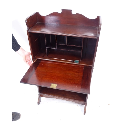 2296 - An Arts and Crafts mahogany student's bureau, the fall-front revealing a fitted interior, with 2 she... 