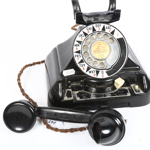 243 - A large Vintage black Bakelite dial telephone, with enamel dial