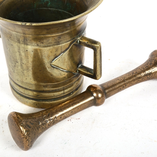 245 - An Antique bronze pestle and mortar, mortar height 13cm