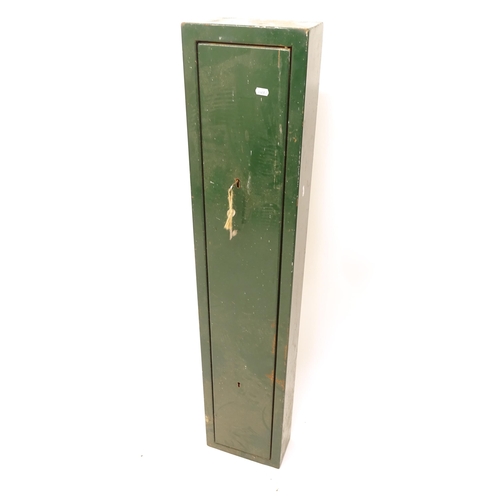 2503 - A green painted metal lockable gun cabinet, W25cm, H126cm, D12cm (with key)