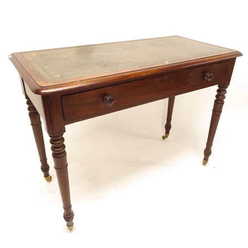 2505 - A Victorian mahogany writing table, with single frieze drawer, on turned legs, and green leather ski... 