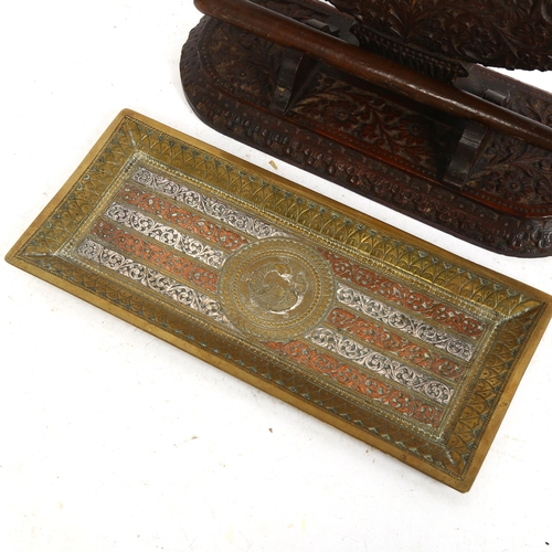 258 - A Middle Eastern silver and copper inlaid brass pen tray, 11cm x 26cm, and an Indian hardwood dinner... 