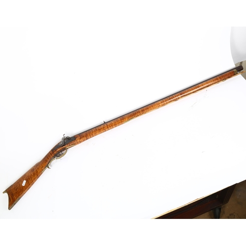 303 - A muzzle loading percussion musket, with tiger stripe stock and octagonal 96cm long barrel