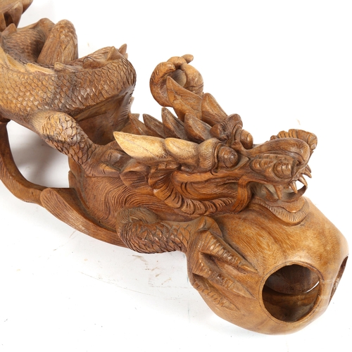 347 - A Chinese carved hardwood dragon and pearl figure, length 48cm