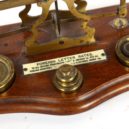 363 - Vintage set of brass postal scales and weights, width 21cm