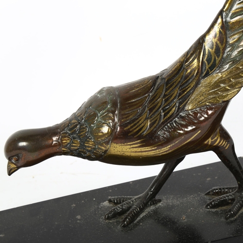 368 - An Art Deco style patinated spelter sculpture, prowling pheasant, unsigned, on black slate base, len... 