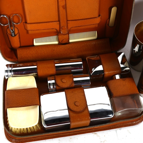 397 - A leather-cased set of 4 WMF electroplate beakers, and an Art Deco travelling vanity set (2)