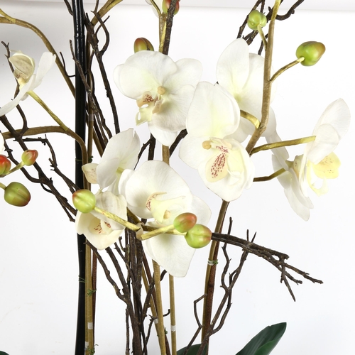 422 - OKA , A large display of ornamental orchid flowers, height 95cm