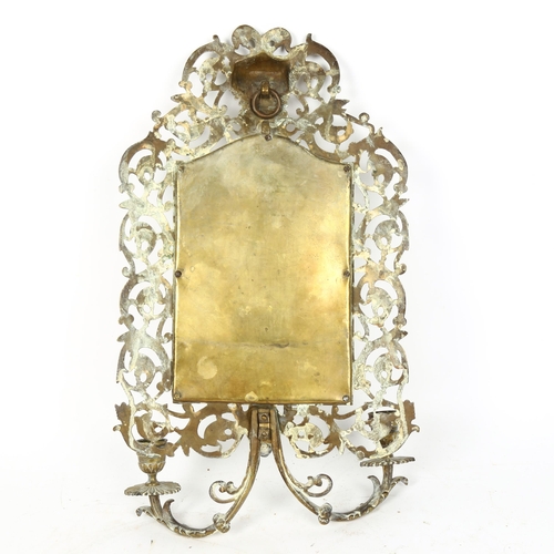 72 - An Antique cast-brass Bacchus wall sconce mirror, probably by Bradley & Hubbard, 44cm x 24cm