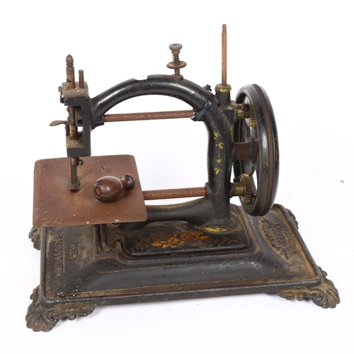 79 - An Antique cast-iron 'The Favourite' sewing machine, by JCW & Co, base length 31cm