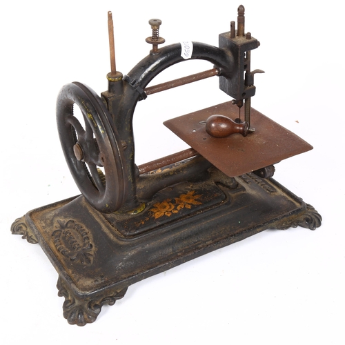 79 - An Antique cast-iron 'The Favourite' sewing machine, by JCW & Co, base length 31cm