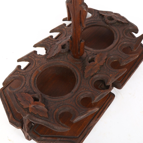 80 - A German Black Forest stained oak and pine decanter/bottle stand, length 34cm, height 32cm