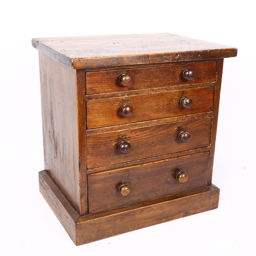 85 - A Vintage stained pine collector's table-top chest of drawers, W31cm, H32cm, D23cm