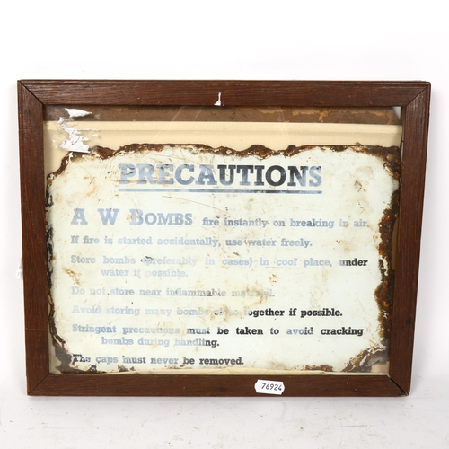 94 - A Vintage A W Bombs Precaution enamel sign, 20cm x 30cm, framed