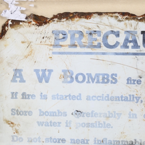 94 - A Vintage A W Bombs Precaution enamel sign, 20cm x 30cm, framed