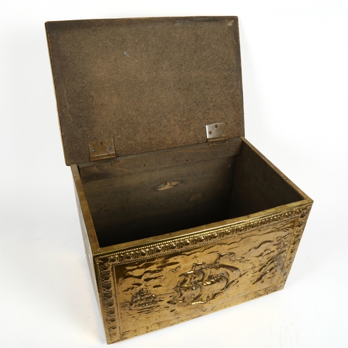 461 - A brass-clad coal box with design of galleons, 41cm across