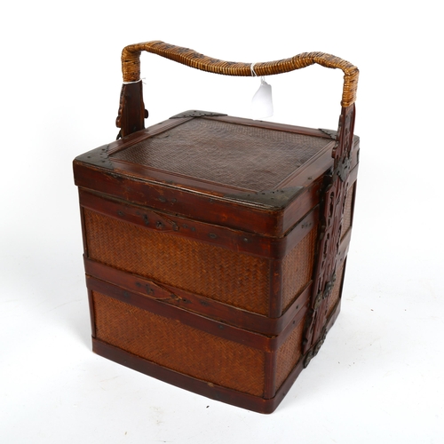 473 - A Chinese metal-bound stained wood 2-section food box, with woven cane panels and cane-bound pierced... 