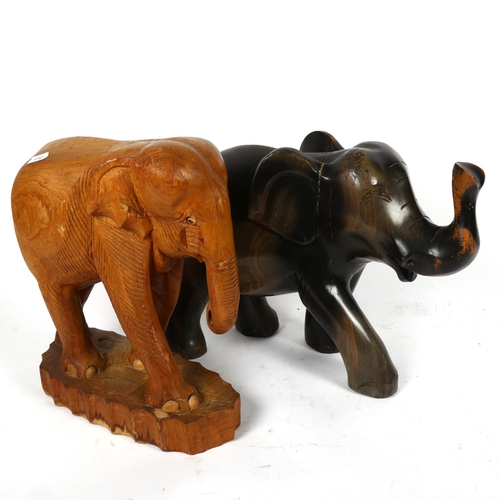 519 - 2 carved wood elephants, tallest 32cm