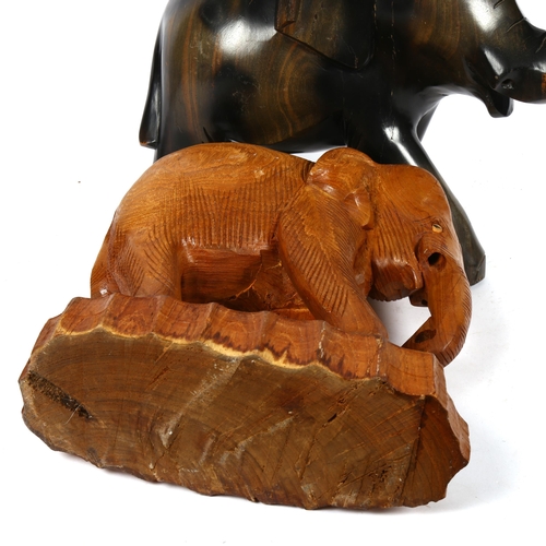 519 - 2 carved wood elephants, tallest 32cm