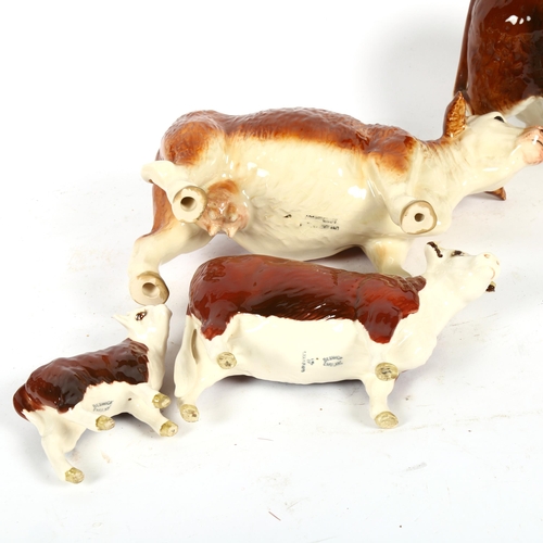 529 - A small Beswick cow, Champion of Champions, and her calf, and a larger cow and bull