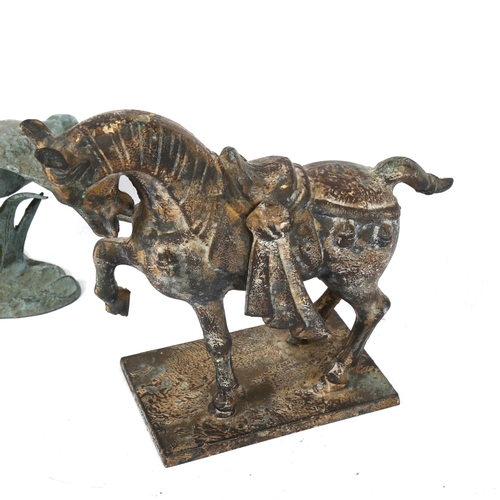 577 - A Tang style horse, and a verdigris metal pair of flying geese, 22cm