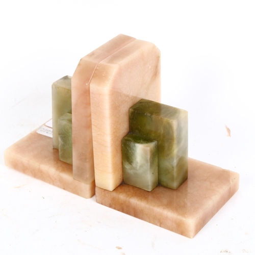 430 - A pair of Art Deco green and peach onyx bookends, height 11.5cm