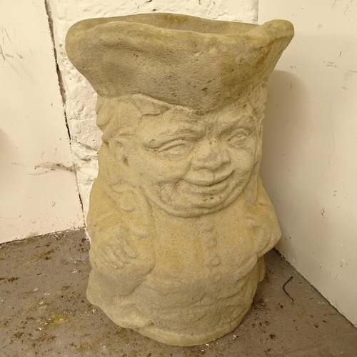 2682 - A concrete garden Toby jug design planter/umbrella stand, W30cm, H42cm