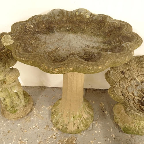 2690 - A weathered concrete shell design bird bath, W55cm, H67cm