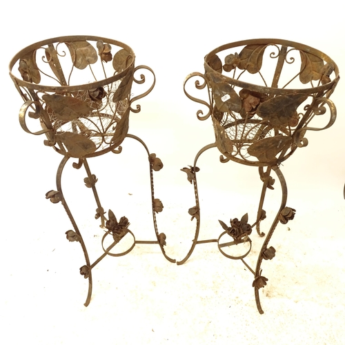 2704 - A pair of wrought-metal jardiniere stands, with floral decoration, W36cm, H92cm