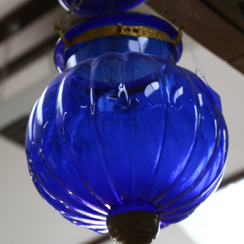 631 - A lobed blue glass pendant light, height 30cm